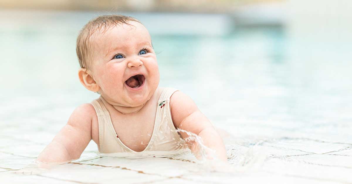 Bambo Nature baby sunscreen mother laughing with baby swim pants